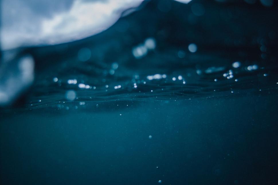 Free Image of Underwater view of calm dark blue water surface 