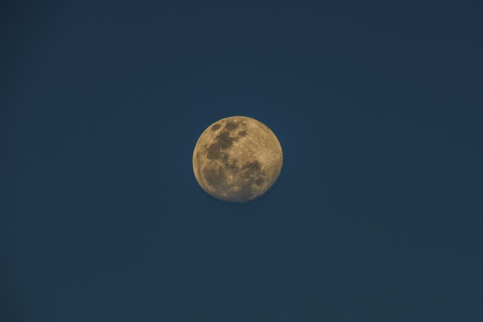 Free Image of A full moon shining against a clear night sky 