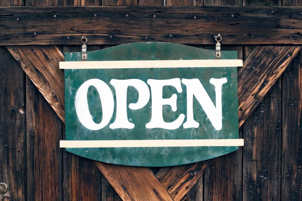 Free Image of Green open sign on wooden background with vintage look 