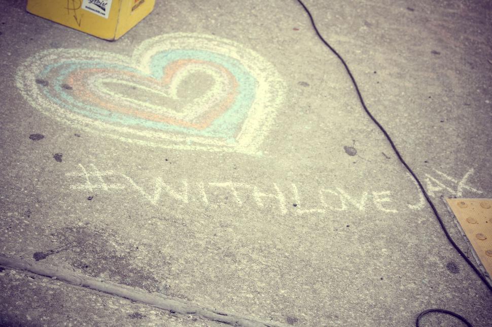 Free Image of Colorful heart with a hashtag chalk drawing nearby. 
