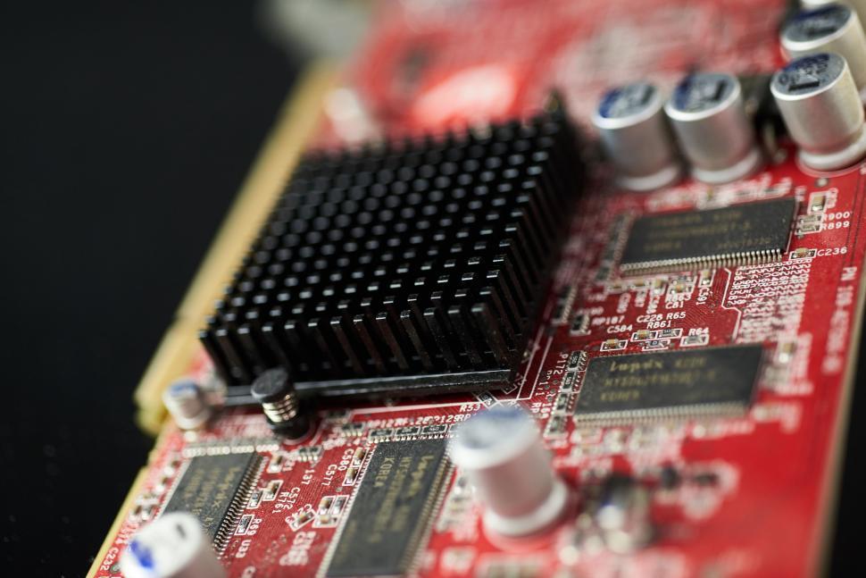 Free Image of Close-up of a computer circuit board in black and red 