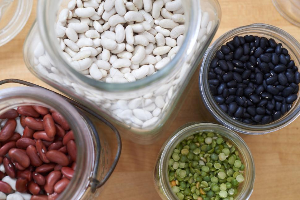 Free Image of Variety of beans and legumes in jars from overhead view 