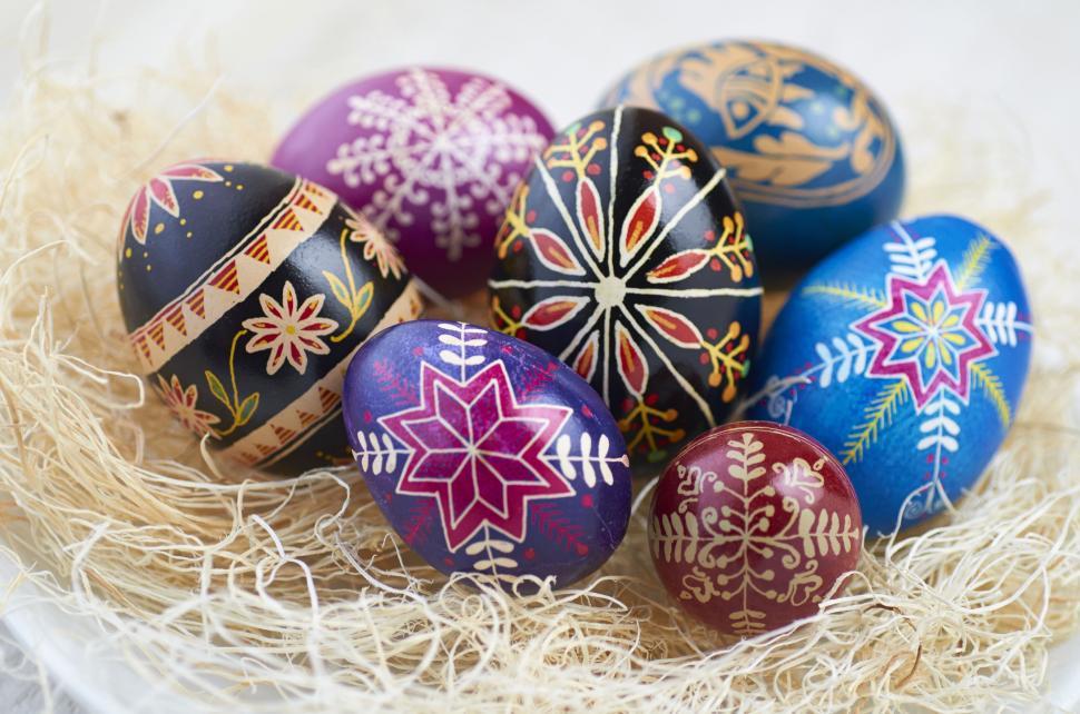 Free Image of Colorful, intricately designed Easter eggs in a nest 