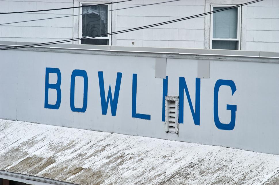 Free Image of Bowling alley building exterior with large sign outside 