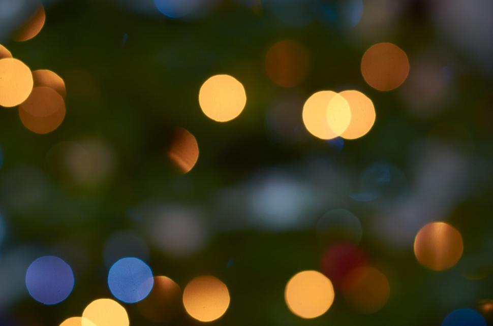Free Image of Bokeh lights against dark background with soft colors 