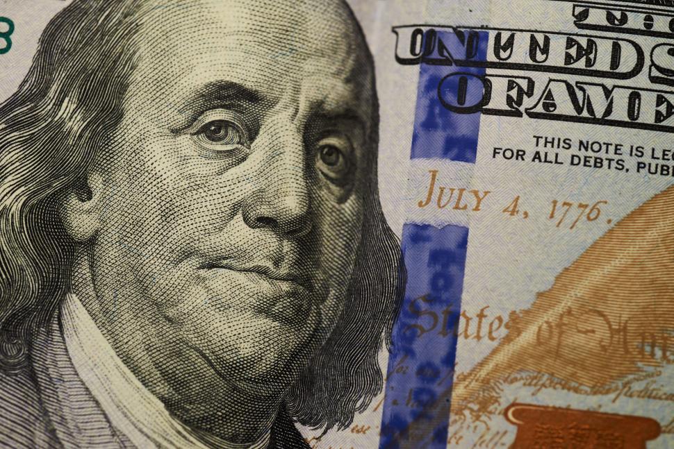 Free Image of Close-up of Benjamin Franklin on US hundred-dollar bill 