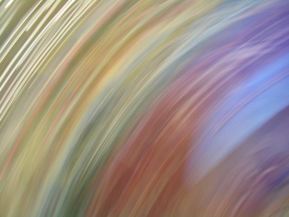 Free Image of Colorful abstract motion blur in vibrant curved swirls 