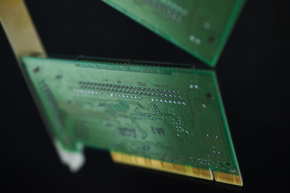 Free Image of Two circuit boards with intricate electronic components. 