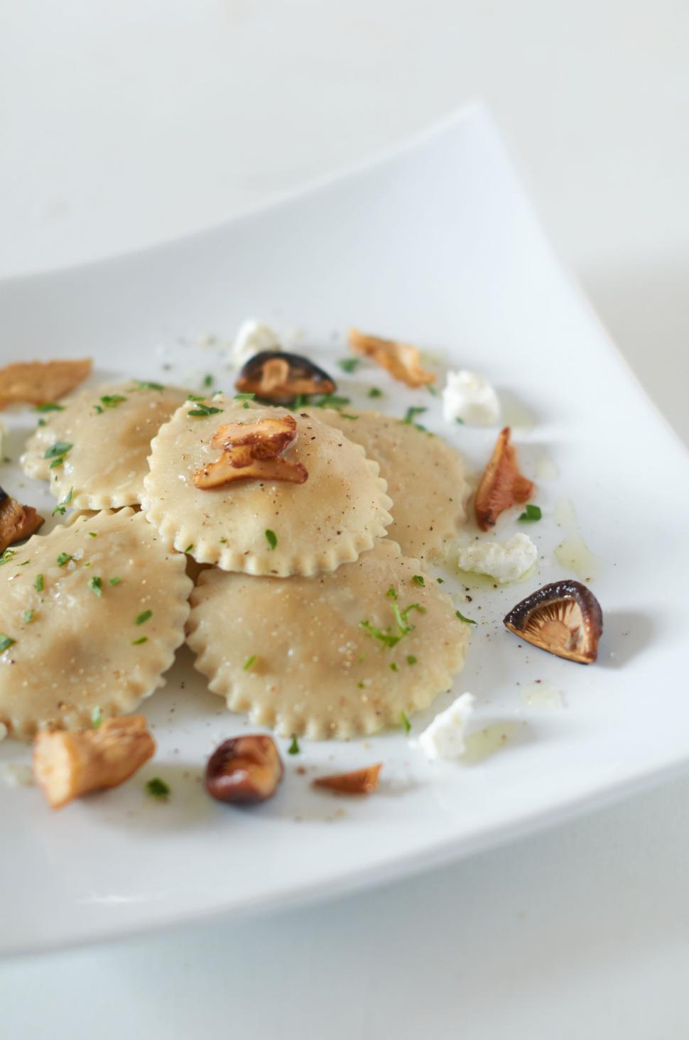 Free Image of Homemade ravioli in white plate with garnishing 