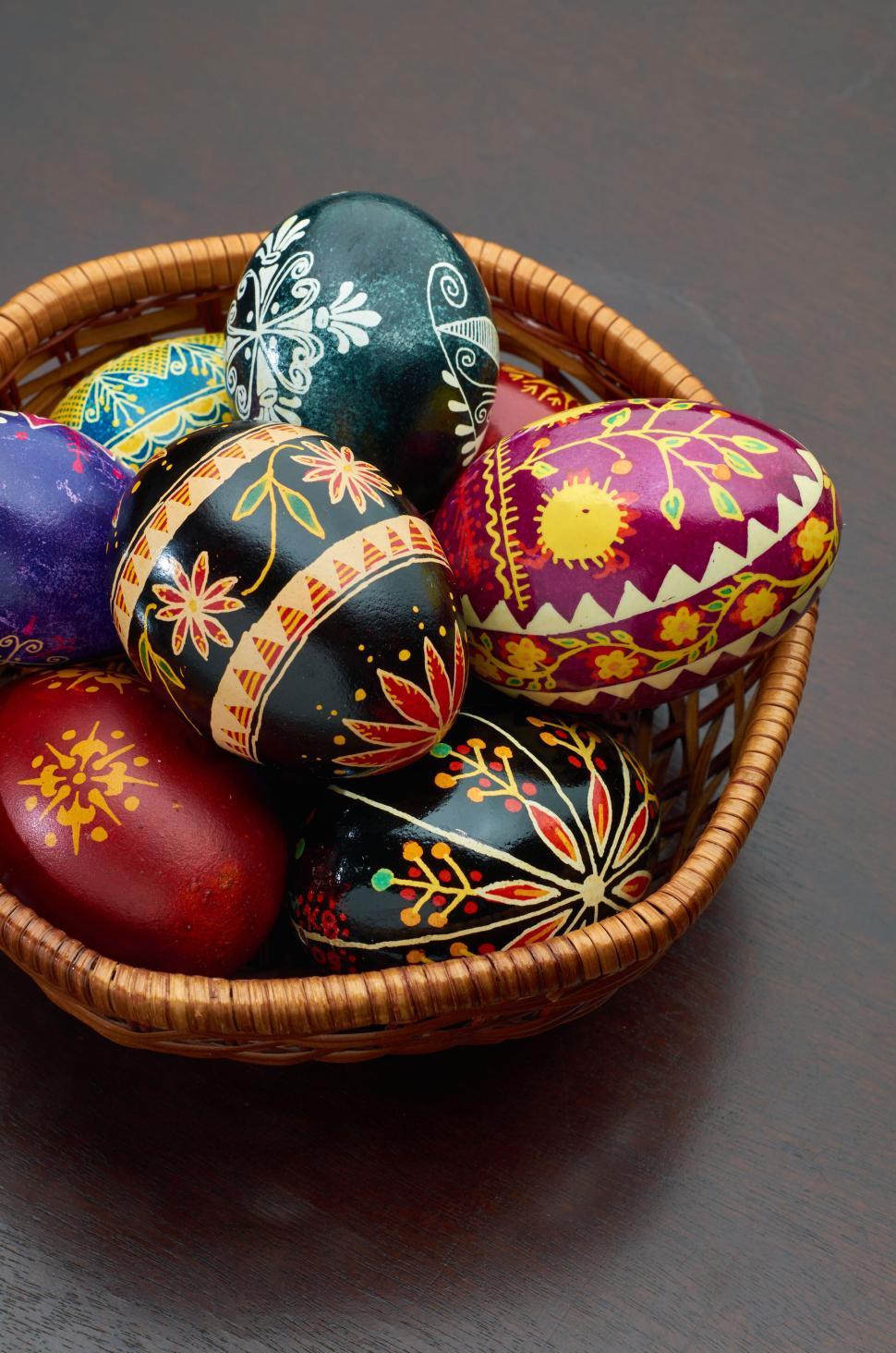 Free Image of Vibrantly painted Easter eggs arranged in a basket 