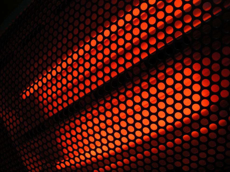 Free Image of Close-up view of active infrared heater in mesh cover 