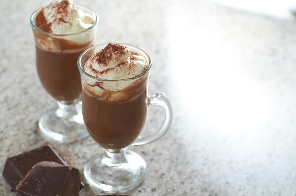 Free Image of Two glass mugs of hot chocolate topped with whipped cream 