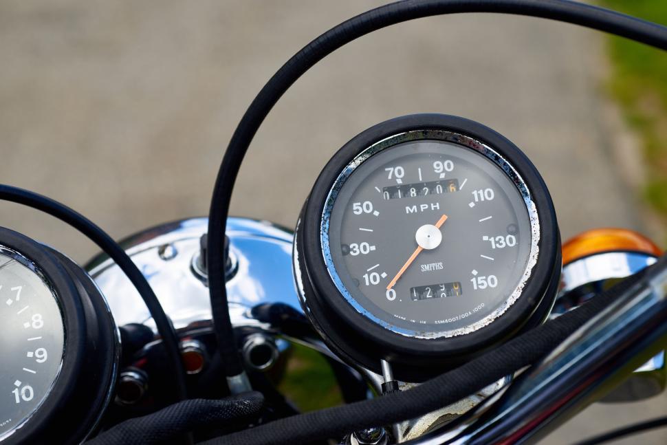 Free Image of Closeup of vintage motorcycle speedometer showing details clearly. 
