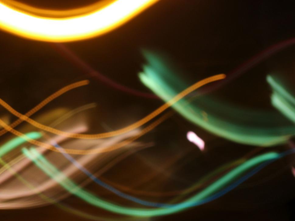 Free Image of Abstract colorful light streaks captured in motion blur 
