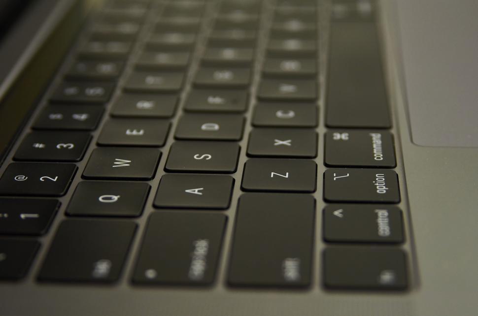 Free Image of Close-up of laptop keyboard with focus on the keys 