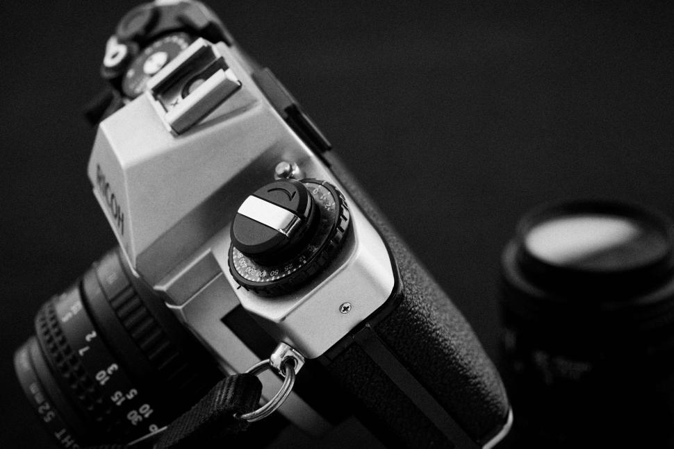 Free Image of Black and white photo of vintage camera on dark background 