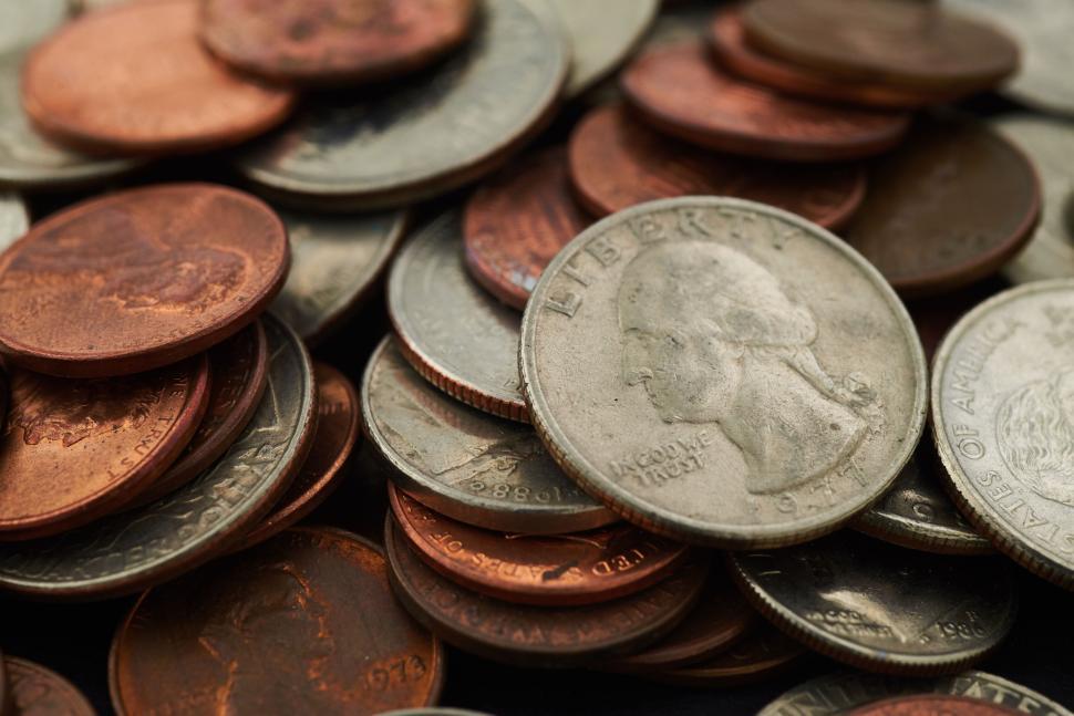 Free Image of Close-up of assorted coins in a scattered arrangement 