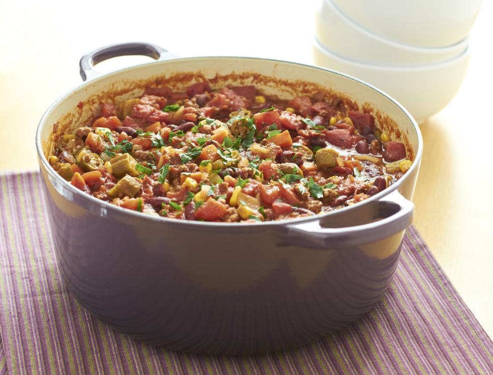 Free Image of Delicious homemade stew in a violet stew pot on table 