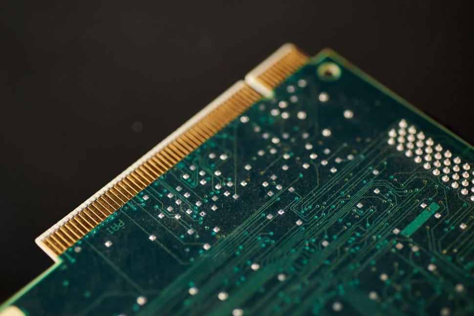 Free Image of Close-up of a green computer circuit board, partial view 