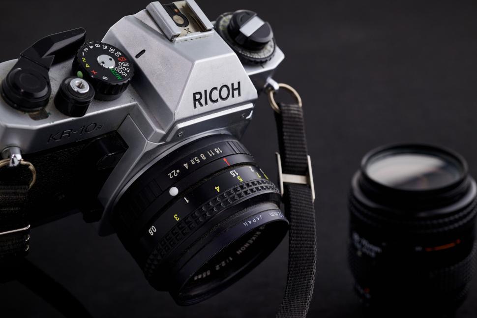 Free Image of Vintage Ricoh film camera with additional camera lens 