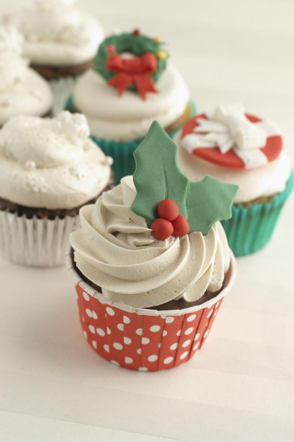 Free Image of Festively decorated cupcakes with holiday themes 