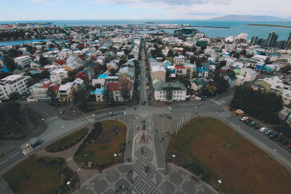 Free Image of Arial view of vibrant coastal city buildings and roads. 
