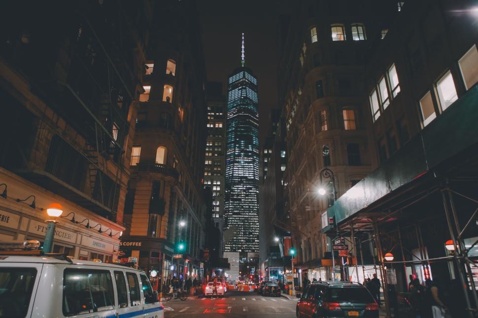 Free Image of Night view of skyscraper and street in a busy city. 