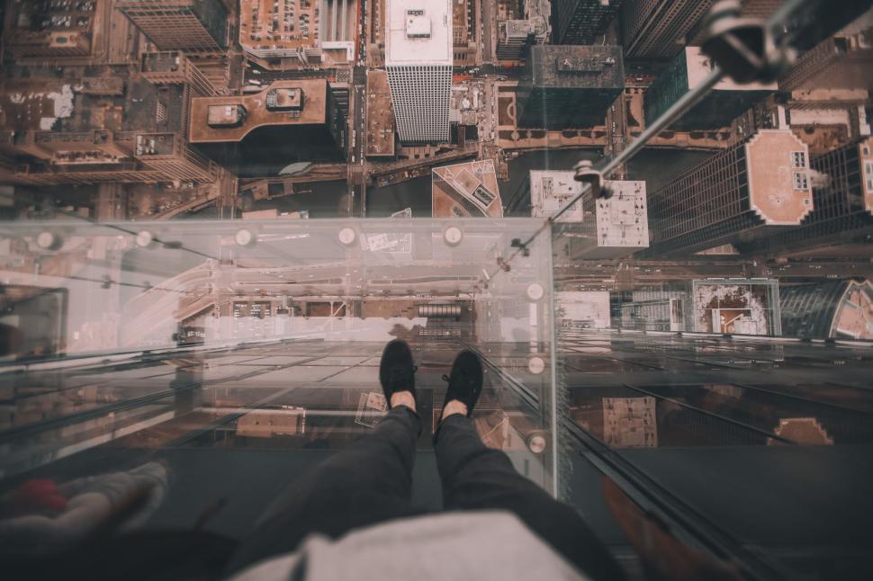 Free Image of View looking down from skyscraper glass observation deck. 
