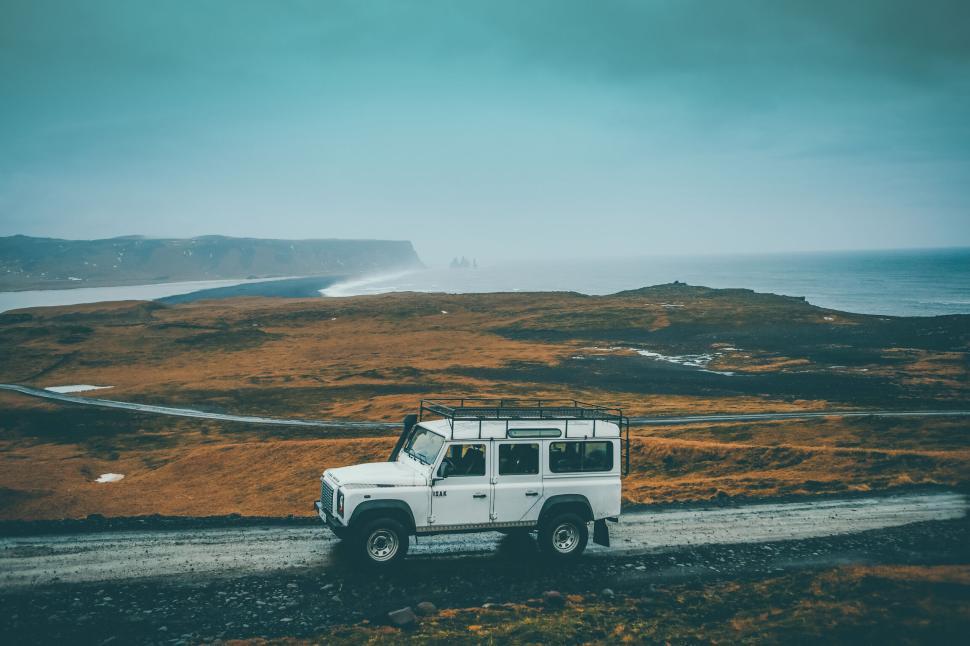 Free Image of Four-wheel drive vehicle on a remote coastal road. 