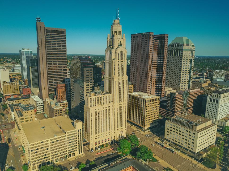 Free Image of Downtown city skyline with tall buildings on a sunny day 