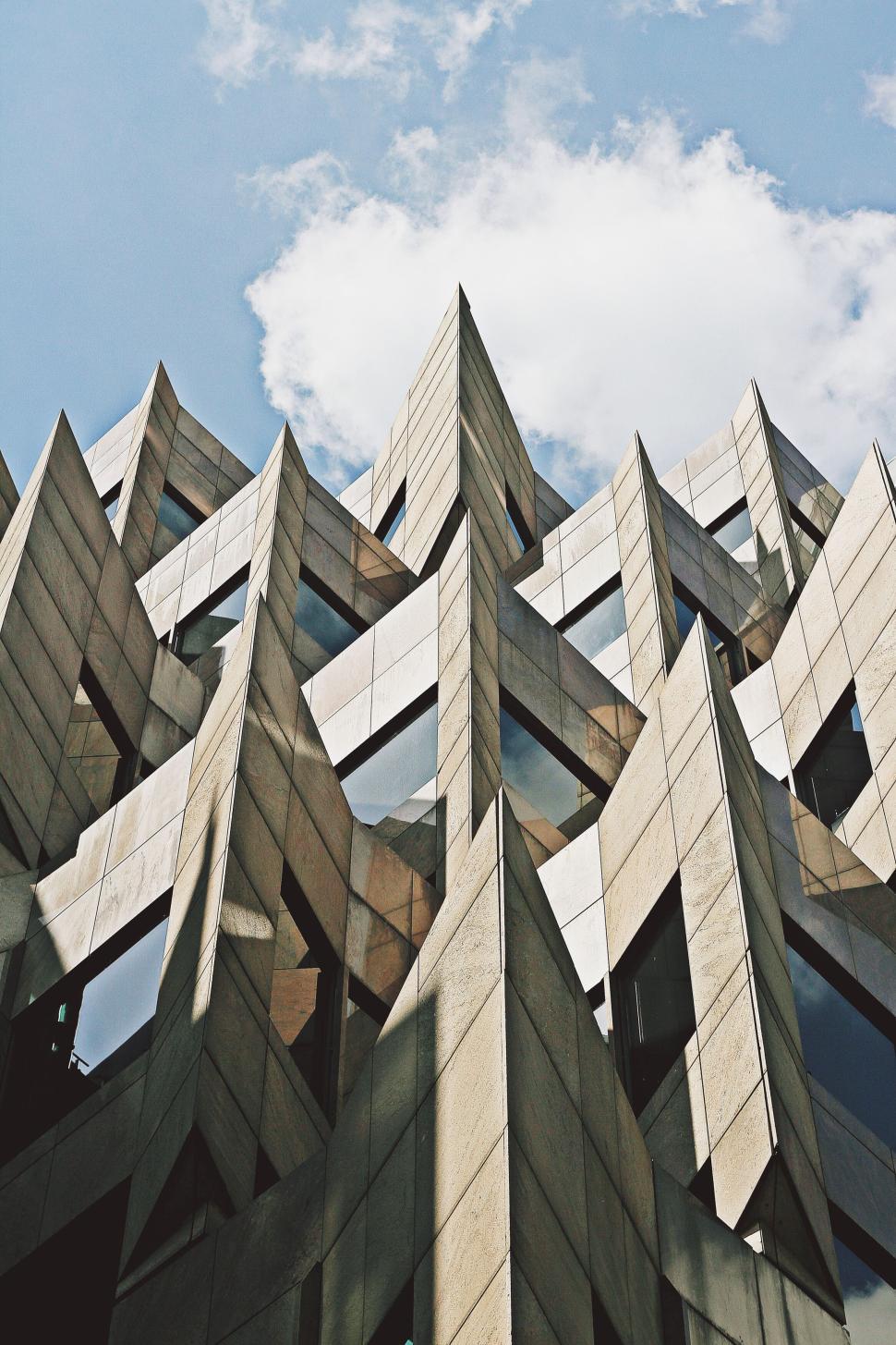 Free Image of Modern angular building exterior against blue sky 
