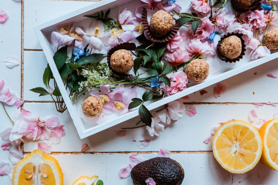 Free Image of Tray with assorted treats and flowers, spring theme 