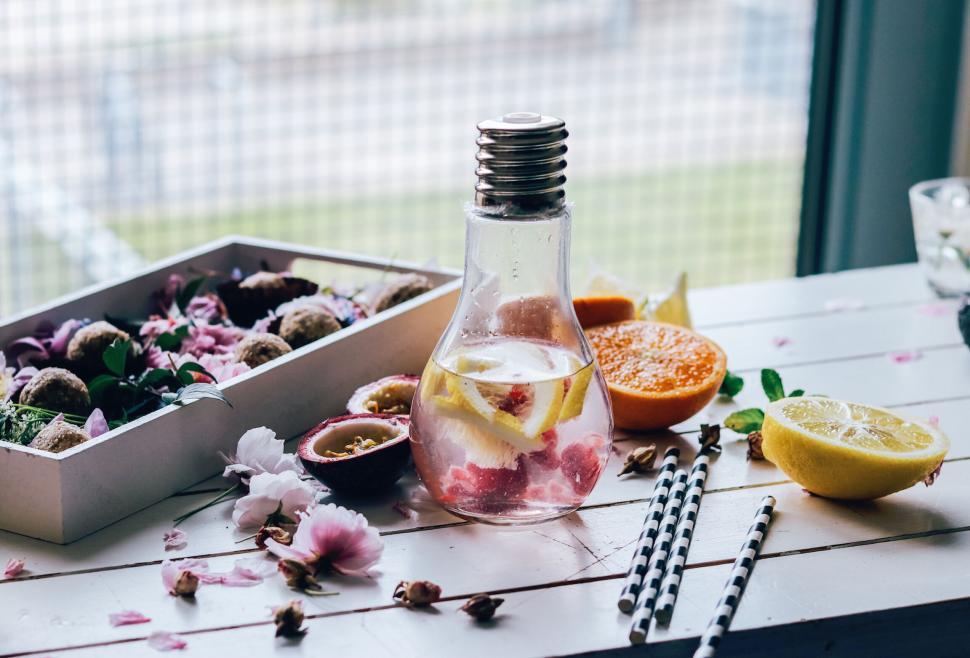 Free Image of Refreshing infused water with citrus fruits and flowers 