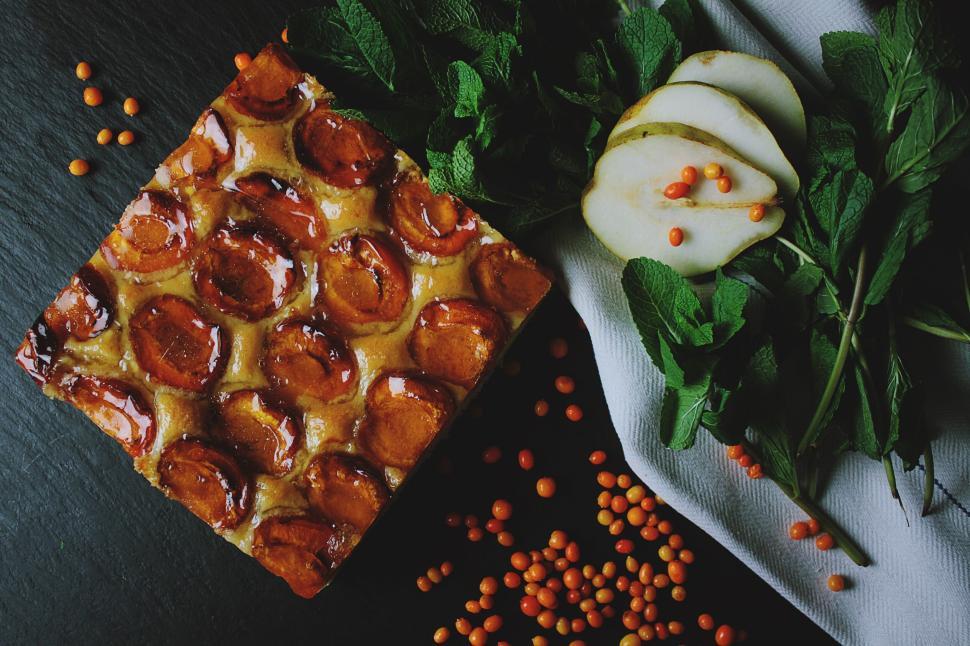 Free Image of Delicious dessert with pears and garnish on display. 