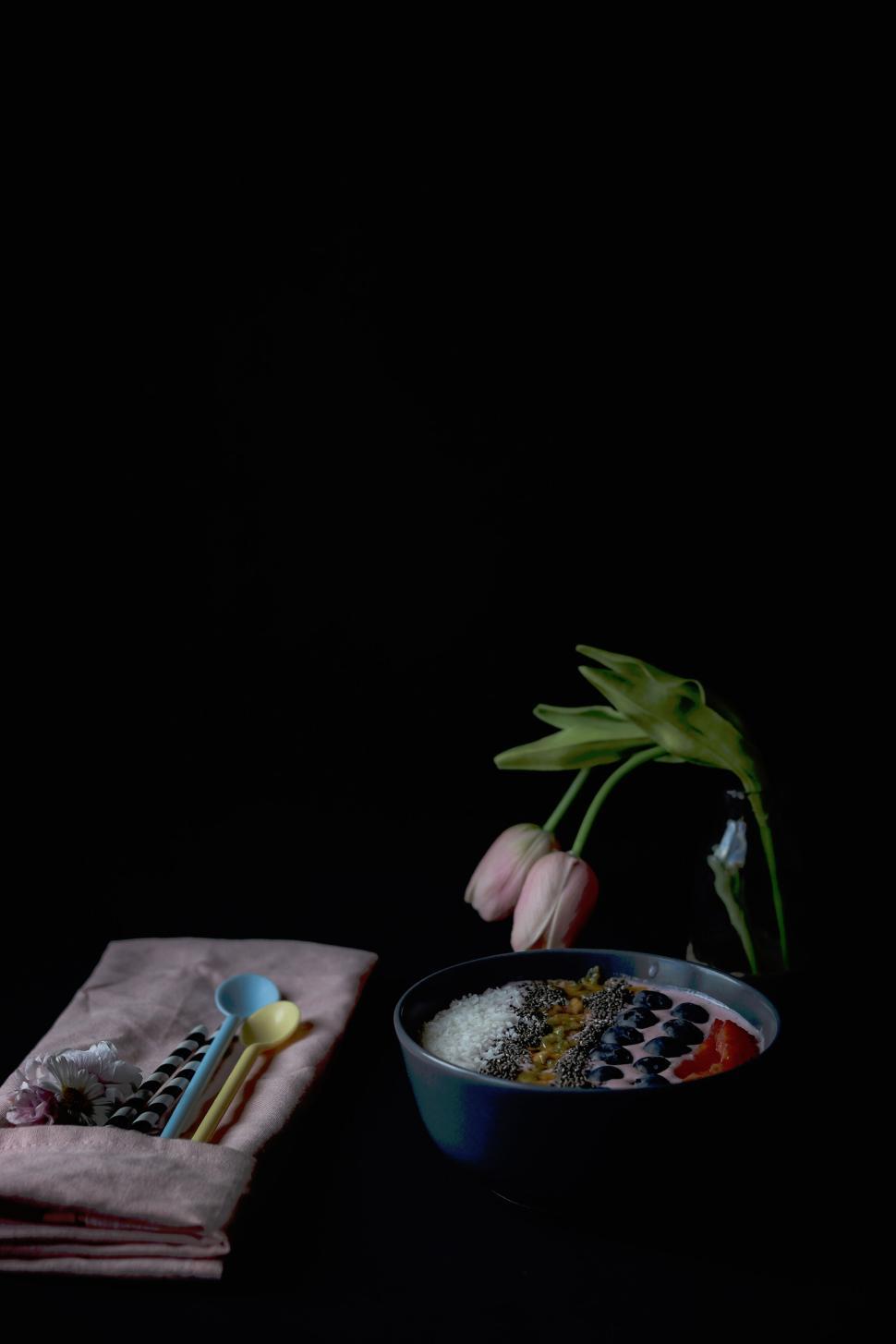 Free Image of Bowl of healthy fruits and seeds with a napkin nearby. 