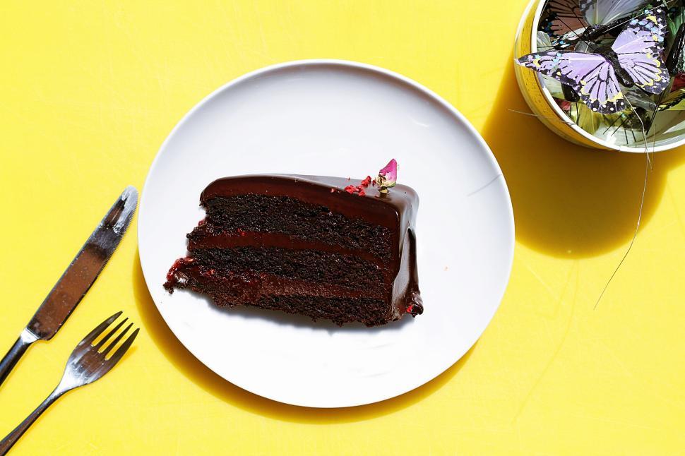 Free Image of Single slice of chocolate cake on white plate with fork 