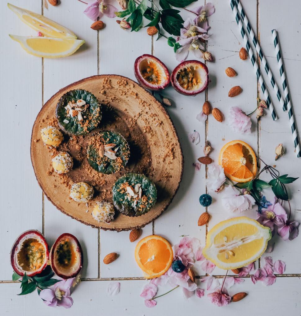 Free Image of Artful arrangement of desserts with fruits and nuts. 