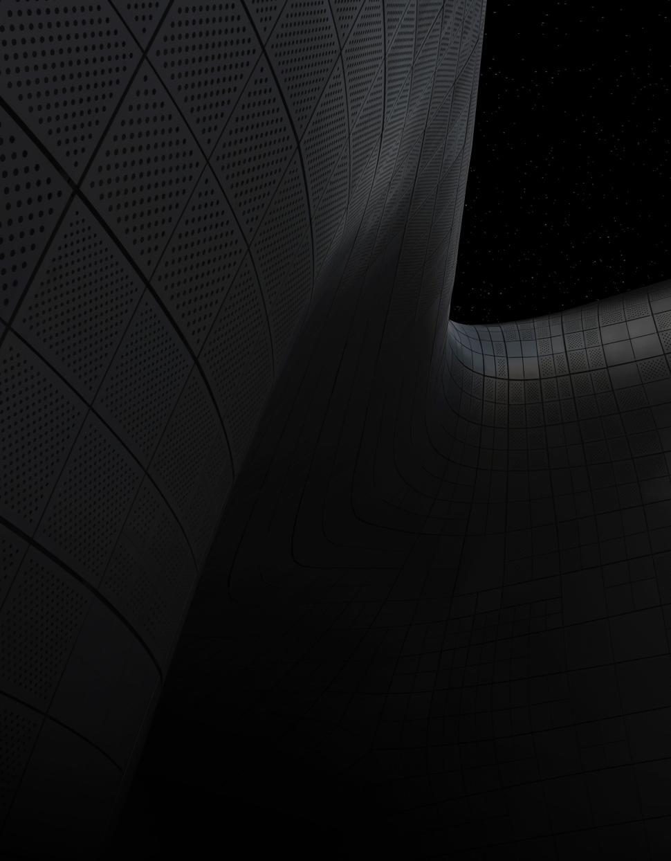 Free Image of Dark illuminated futuristic curved architectural structure. 