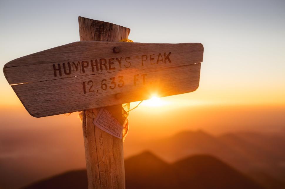 Free Image of Humphreys Peak signpost at captivating sunset. 