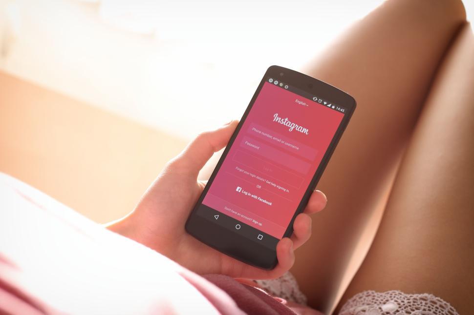 Free Image of Person holding smartphone with Instagram login screen 