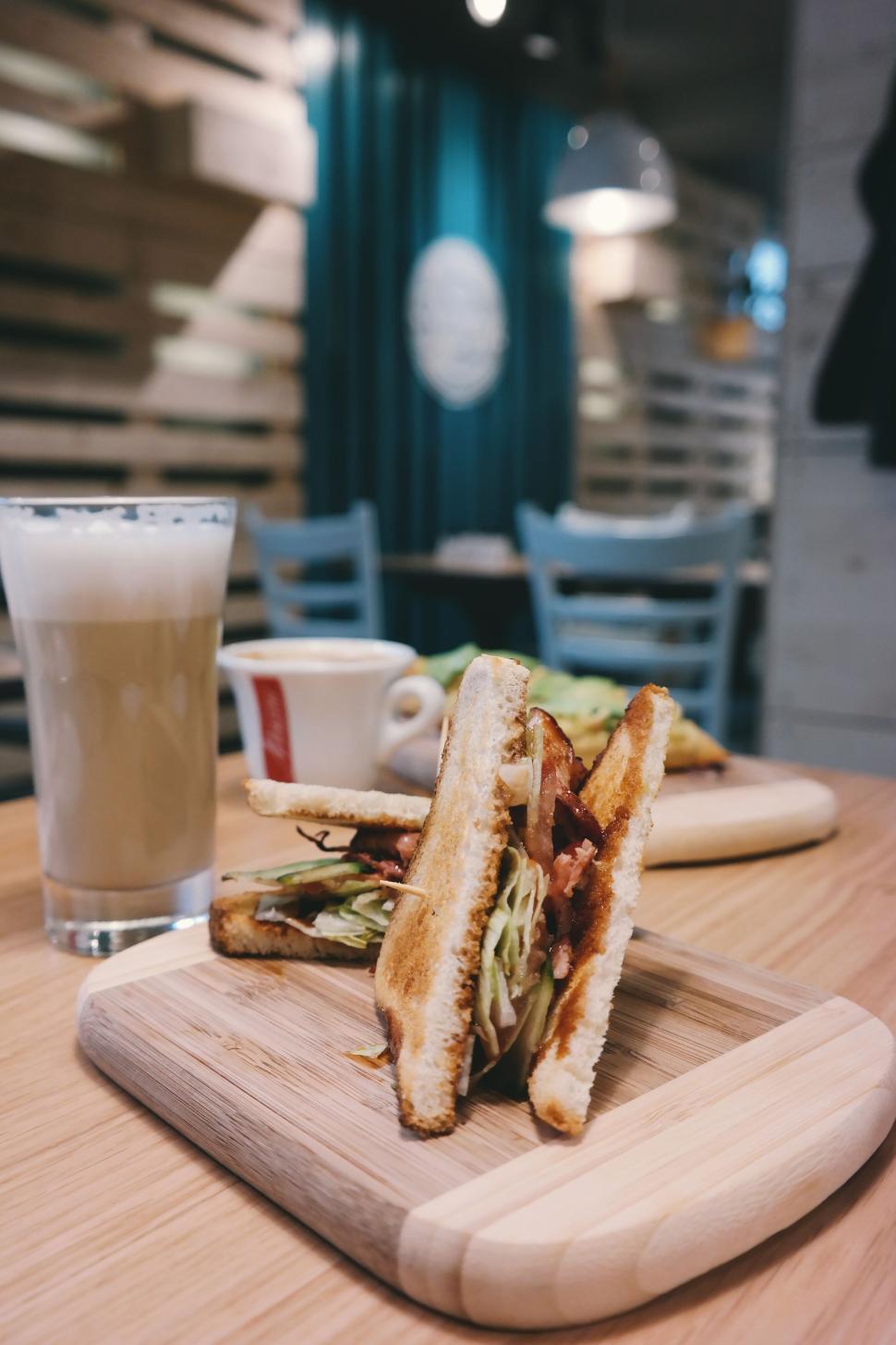 Free Image of Toasted sandwich and coffee set on a wooden board 