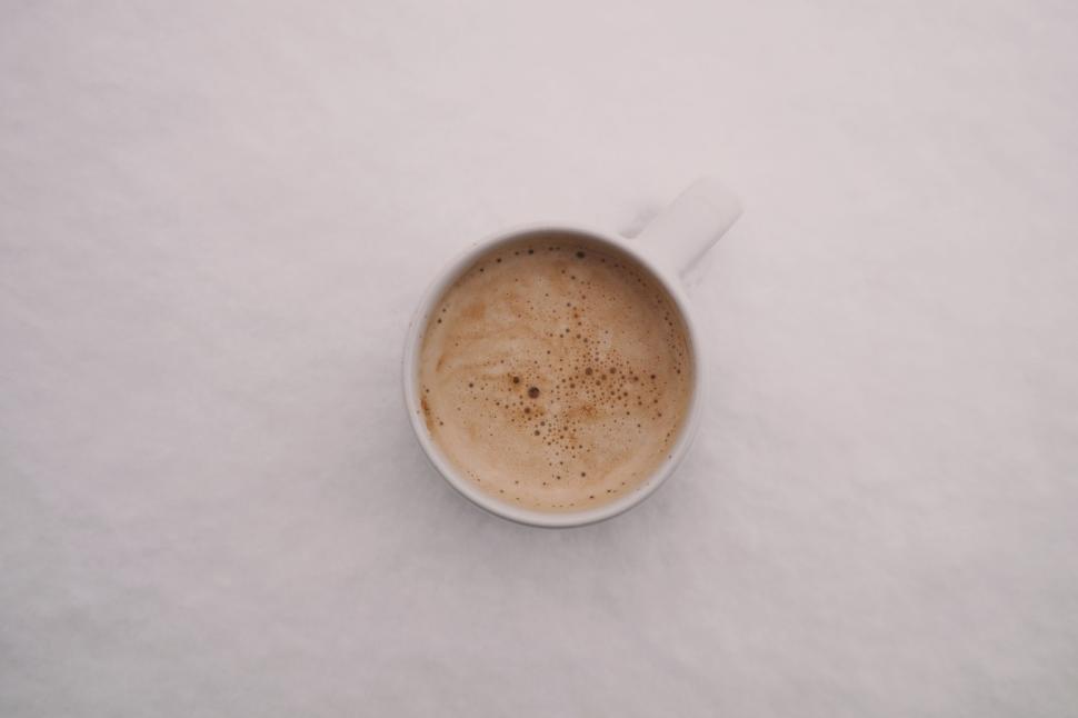 Free Image of Hot cup of coffee on a snowy white background setting 