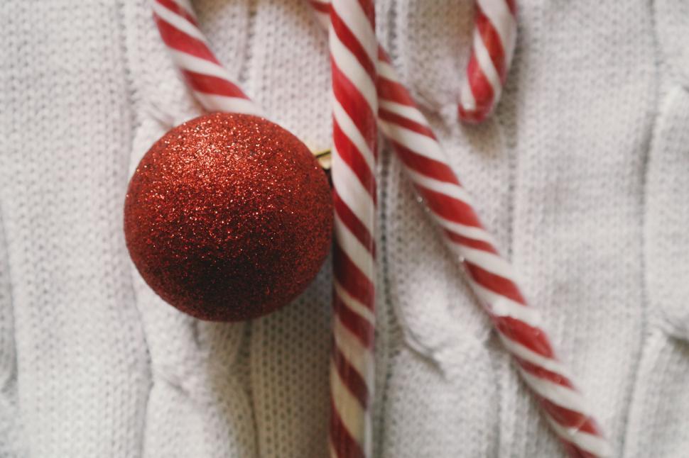 Free Image of Red glittery Christmas ornament with candy canes 