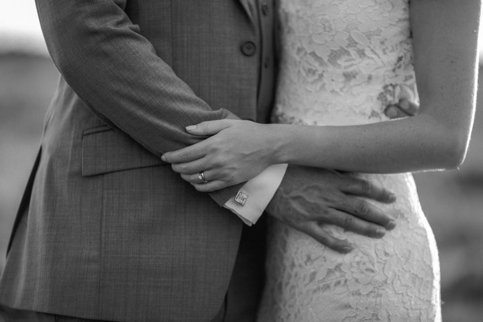 Free Image of Bride and groom embracing each other intimately 