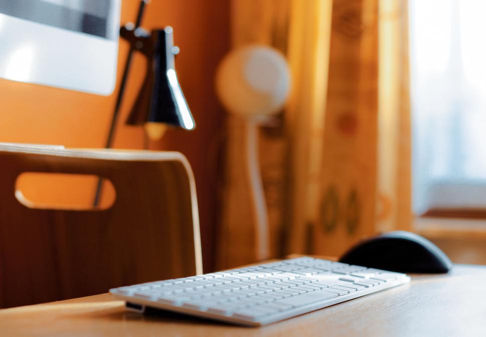 Free Image of Modern workspace with computer and desk lighting setup 