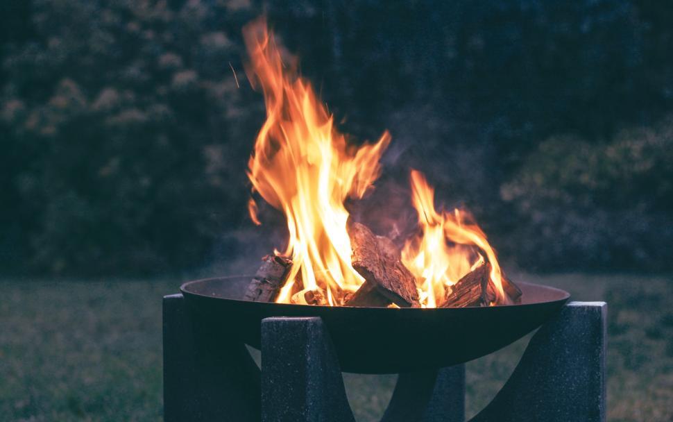 Free Image of Bright campfire burning in outdoor fire pit at night 