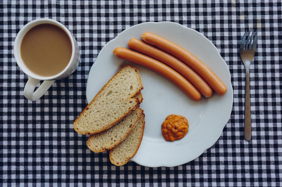 Free Image of Breakfast plate with sausages, bread, mustard, coffee cup 