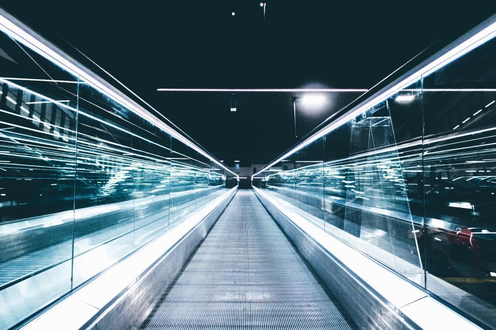 Free Image of Futuristic airport travelator view with light reflections 