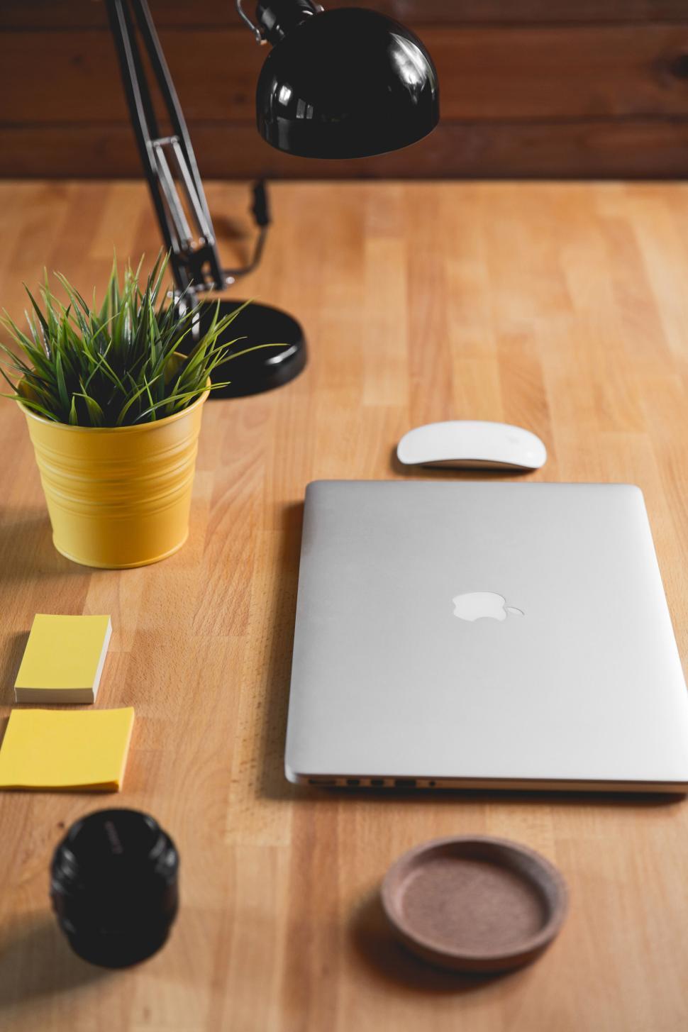 Free Image of Laptop and workspace essentials on wooden desk 