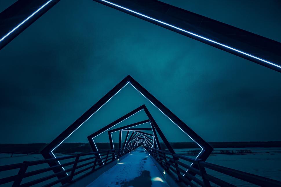 Free Image of Futuristic illuminated bridge with geometric metal frame. 